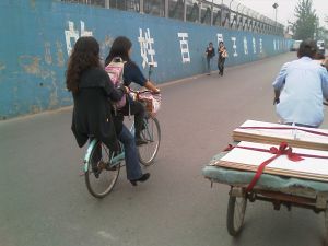 Hitching a ride from my friend Wingee. We shopped at a fruit wholesaler - this is the real China experience, boys and girls.